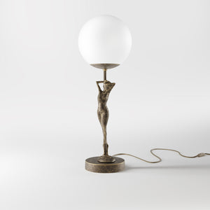 Brass table lamp with sculpted female figure and frosted glass globe, ideal for elegant interiors by Ghidini 1849 - Finish: OAS Antique Brass