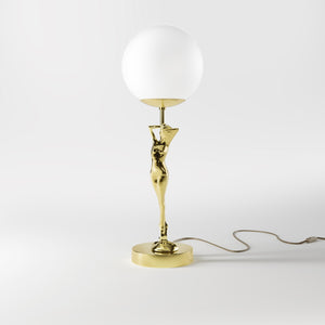 Brass table lamp with sculpted female figure and frosted glass globe, ideal for elegant interiors by Ghidini 1849 - Finish: OLV Polished Brass
