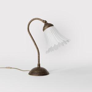 Table lamp with adjustable brass arm and wavy frosted glass shade, round base, classic Italian design by Ghidini 1849 - Finish: OAS Antique Brass