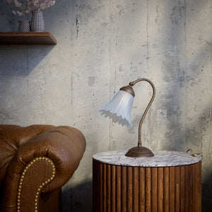 Table lamp with adjustable brass arm and wavy frosted glass shade, round base, classic Italian design by Ghidini 1849 - Finish: OAS Antique Brass