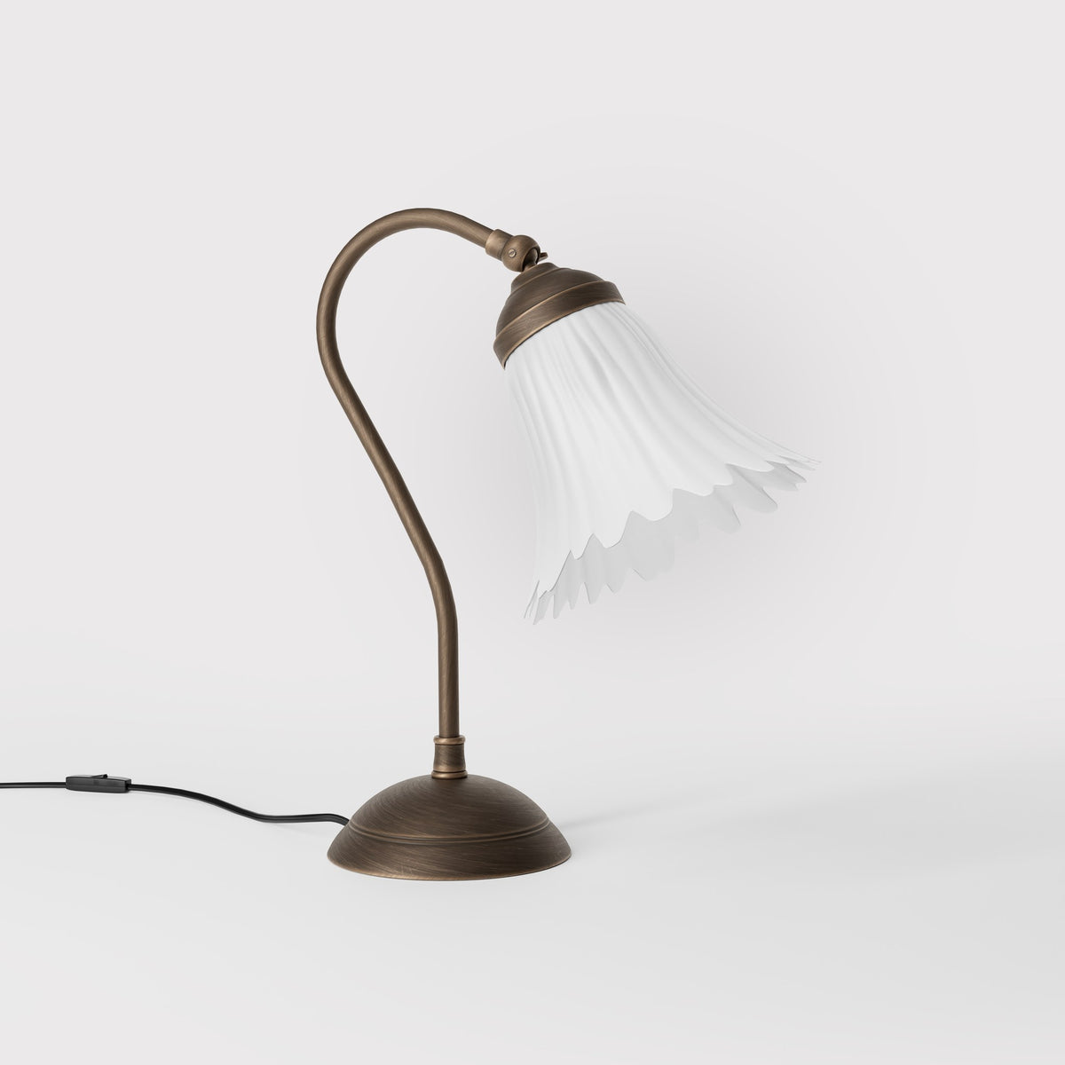 Table lamp with adjustable brass arm and wavy frosted glass shade, round base, classic Italian design by Ghidini 1849 - Finish: OBM Bronze Satin Matt Brass