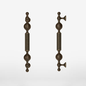 Brass pull handle with baroque details, fluted sections, and sculpted elements, perfect for luxury entrances by Ghidini 1849 - Finish: OBM Bronze Satin Matt Brass