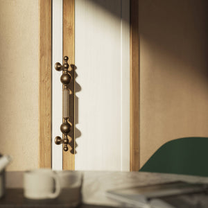 Brass pull handle with baroque details, fluted sections, and sculpted elements, perfect for luxury entrances by Ghidini 1849 - Finish: OBM Bronze Satin Matt Brass