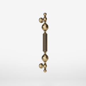 Brass pull handle with baroque details, fluted sections, and sculpted elements, perfect for luxury entrances by Ghidini 1849 - Finish: OBS Bronze Satin Brass