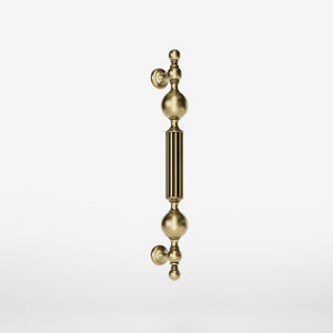 Brass pull handle with baroque details, fluted sections, and sculpted elements, perfect for luxury entrances by Ghidini 1849 - Finish: OBV Bronze Satin Light Brass