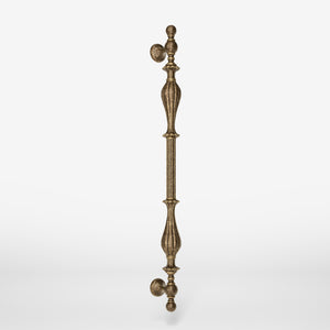 Brass pull handle with refined lines and sculpted details, suitable for single or bilateral installation on classic doors by Ghidini 1849 - Finish: OAS Antique Brass