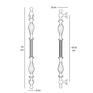 Brass pull handle with refined lines and sculpted details, suitable for single or bilateral installation on classic doors by Ghidini 1849