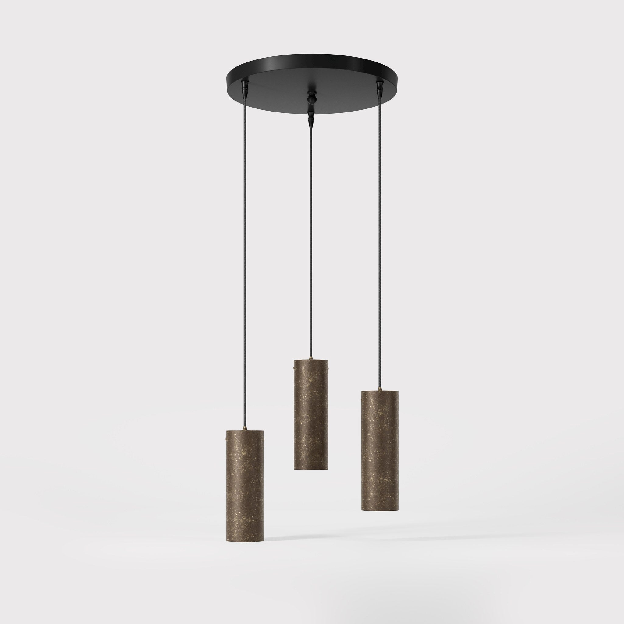 Modern pendant lamp with three brass cylinders and round matte black iron base, height-adjustable pendants, Venere design collection by Ghidini 1849 - Finish: OAS Antique Brass