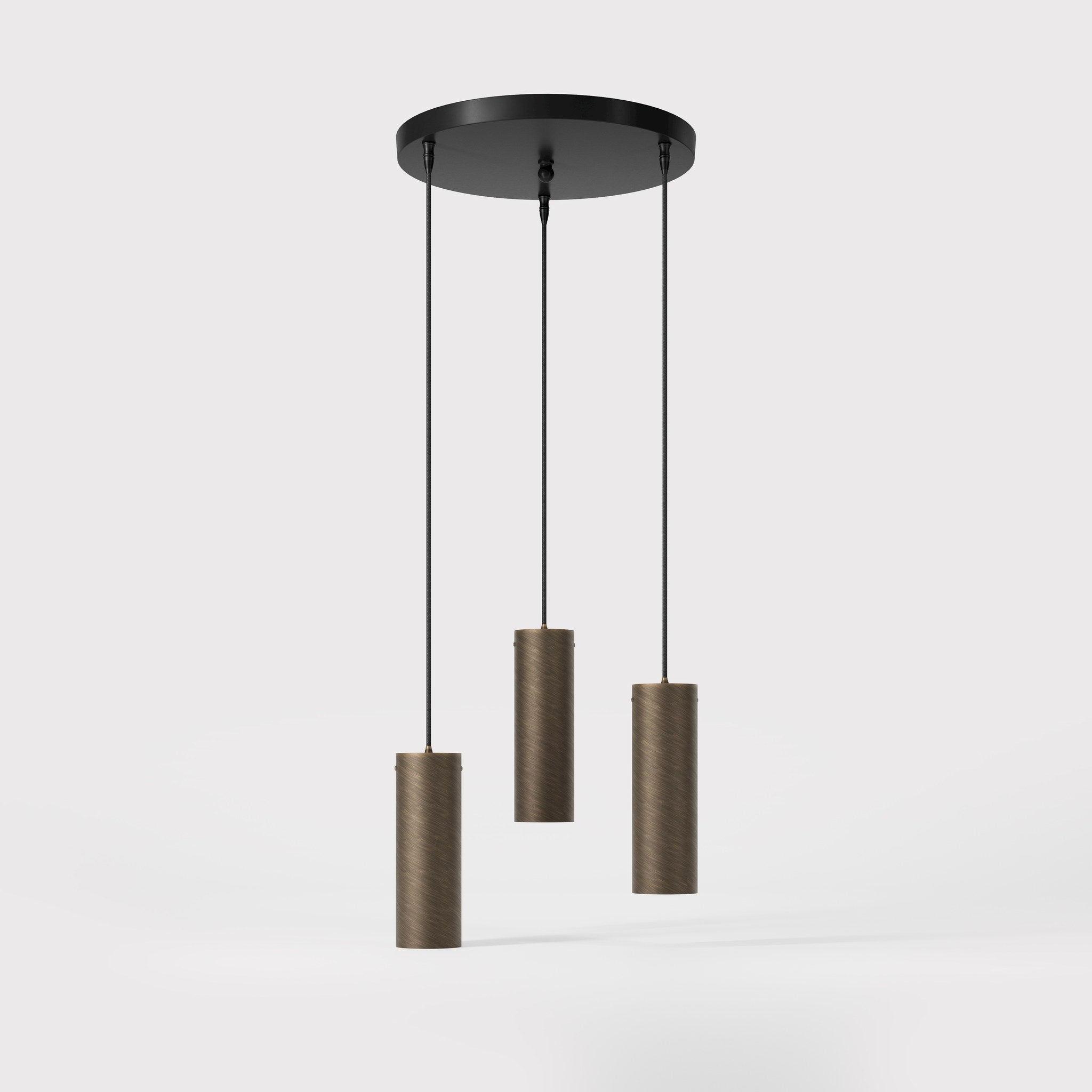 Modern pendant lamp with three brass cylinders and round matte black iron base, height-adjustable pendants, Venere design collection by Ghidini 1849 - Finish: OBM Bronze Satin Matt Brass