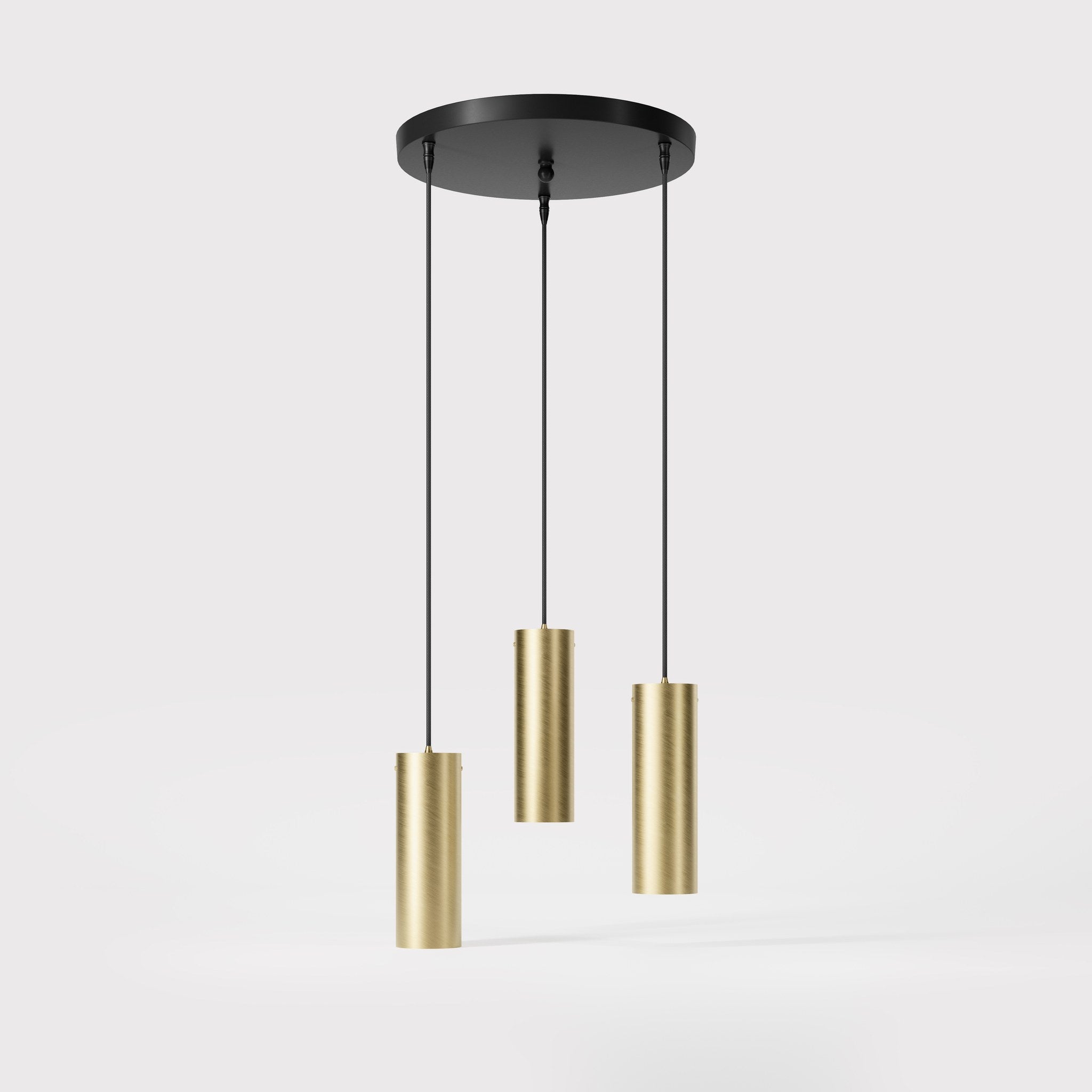 Modern pendant lamp with three brass cylinders and round matte black iron base, height-adjustable pendants, Venere design collection by Ghidini 1849 - Finish: OBV Bronze Satin Light Brass