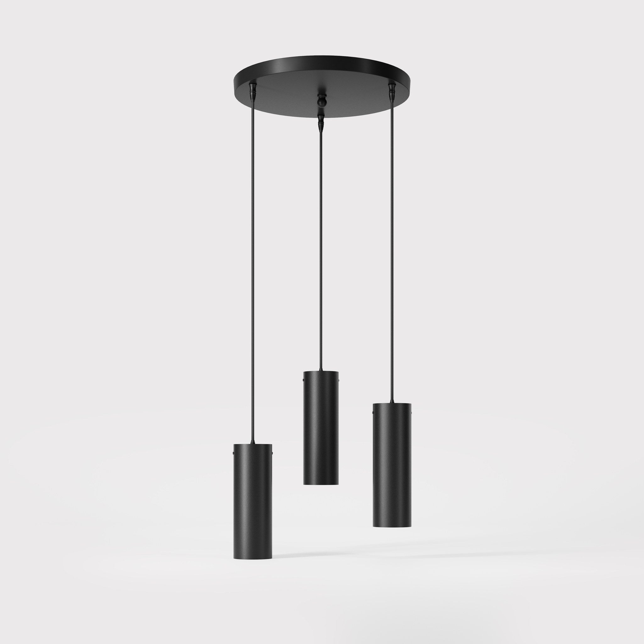 Modern pendant lamp with three brass cylinders and round matte black iron base, height-adjustable pendants, Venere design collection by Ghidini 1849 - Finish: ONO Matt Black
