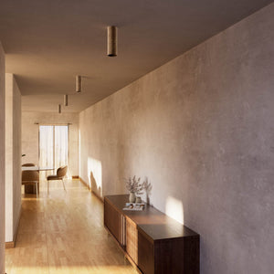 Cylindrical ceiling lamp in brass Venere installed in a contemporary hallway interior by Ghidini 1849 - Finish: OAS Antique Brass