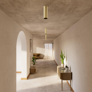 Cylindrical ceiling lamp in brass Venere installed in a contemporary hallway interior by Ghidini 1849 - Finish: OBV Bronze Satin Light Brass