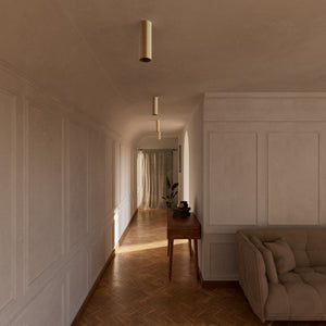 Cylindrical ceiling lamp in brass Venere installed in a contemporary hallway interior by Ghidini 1849 - Finish: OBV Bronze Satin Light Brass