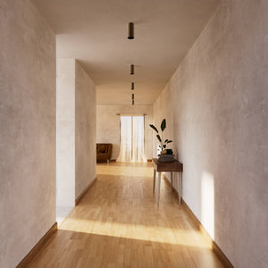 Cylinder ceiling lamp in brass with compact body installed on the ceiling of an elegant corridor by Ghidini 1849 - Finish: OBM Bronze Satin Matt Brass