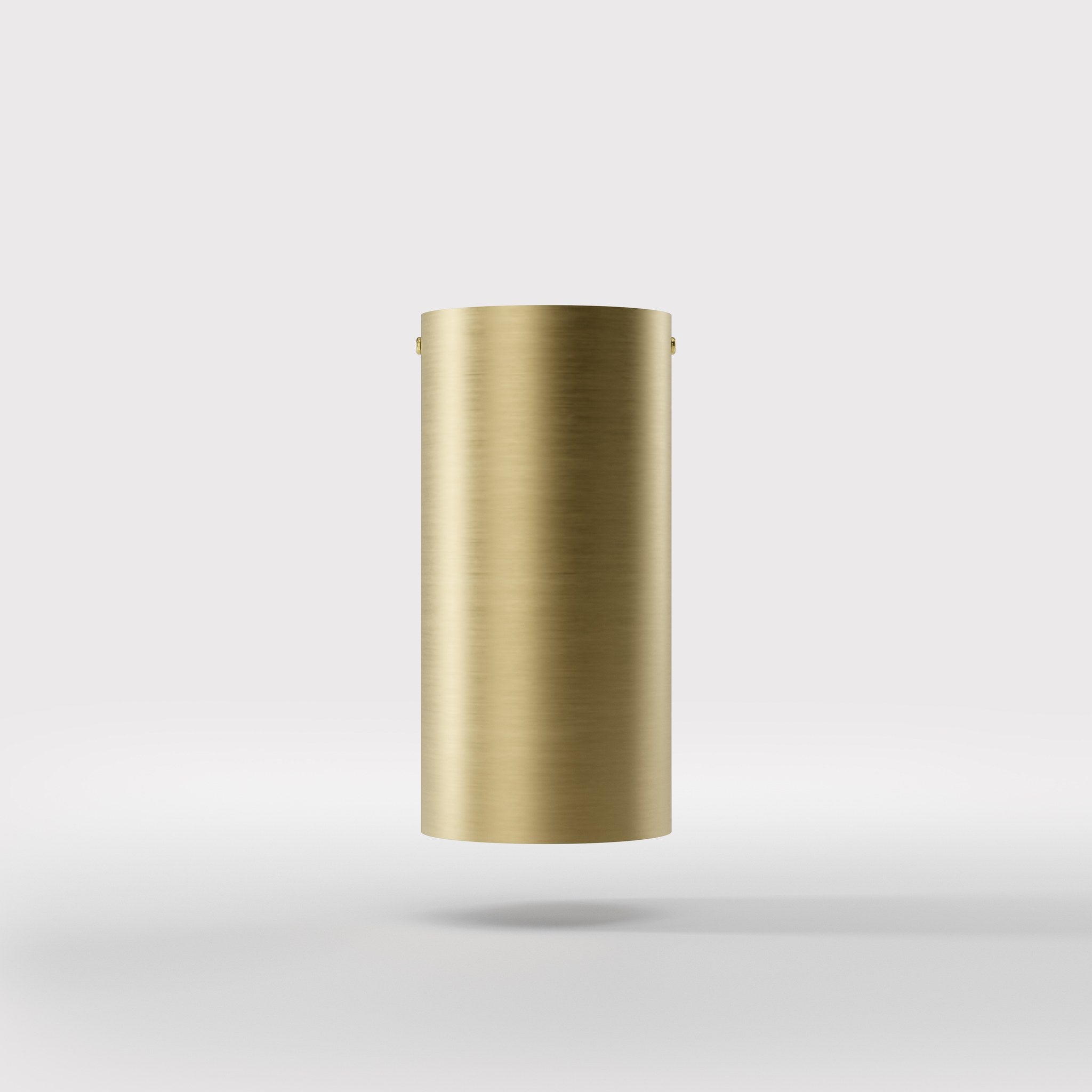 Cylinder ceiling lamp in brass with compact body installed on the ceiling of an elegant corridor by Ghidini 1849 - Finish: OBV Bronze Satin Light Brass