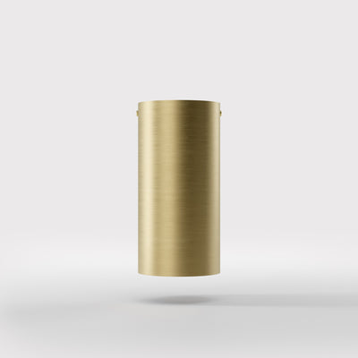 Cylinder ceiling lamp in brass with compact body installed on the ceiling of an elegant corridor by Ghidini 1849 - Finish: OBV Bronze Satin Light Brass
