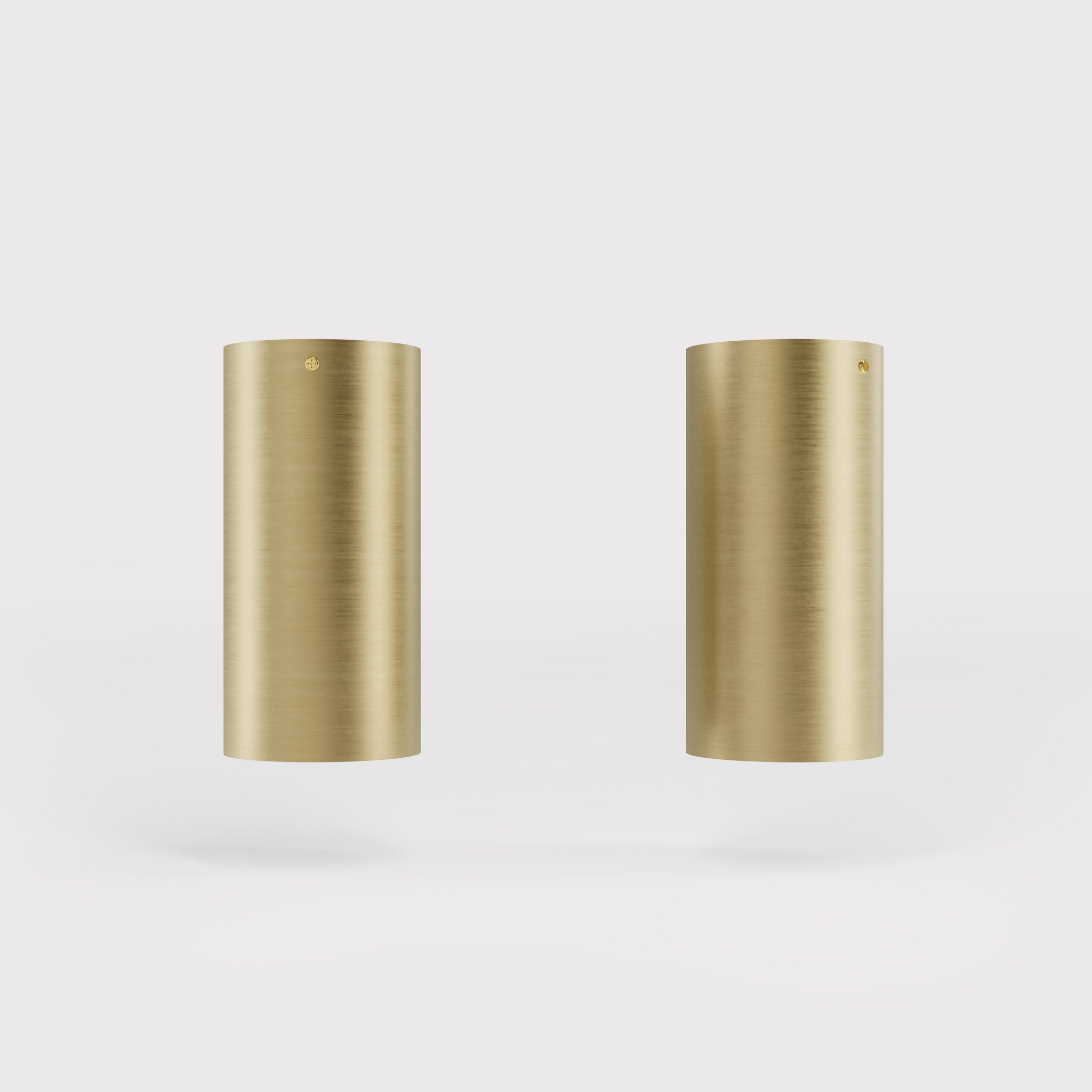 Cylinder ceiling lamp in brass with compact body installed on the ceiling of an elegant corridor by Ghidini 1849 - Finish: OBV Bronze Satin Light Brass