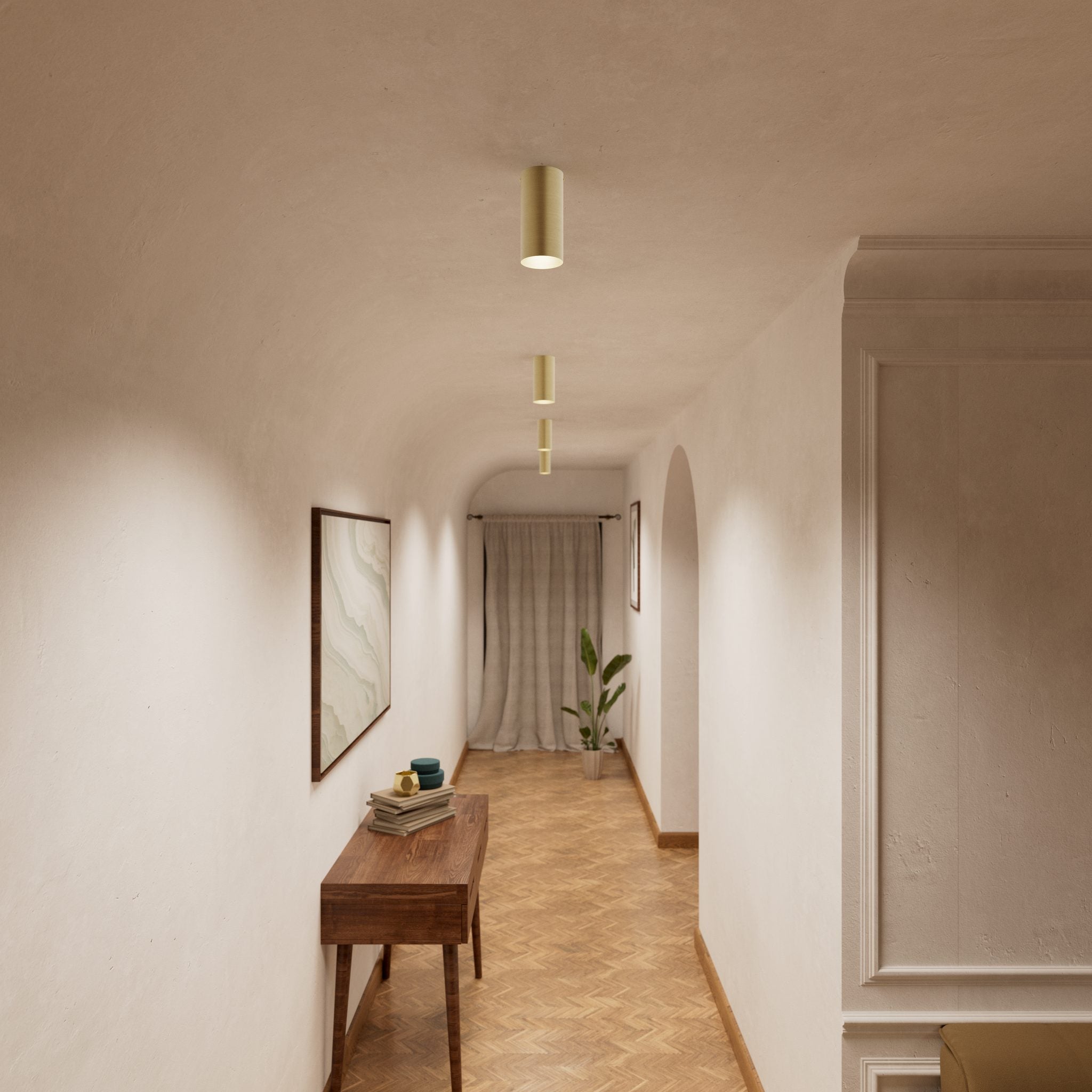 Cylinder ceiling lamp in brass with compact body installed on the ceiling of an elegant corridor by Ghidini 1849 - Finish: OBV Bronze Satin Light Brass