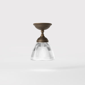 Classic ceiling lamp in brass with a clear conical ribbed glass shade from the Elide range by Ghidini 1849 - Finish: OBM Bronze Satin Matt Brass