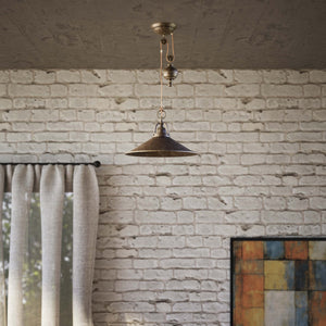 Industrial style brass pendant lamp with pulley system turned spherical counterweight and wide conical shade by Ghidini 1849 - Finish: OAS Antique Brass