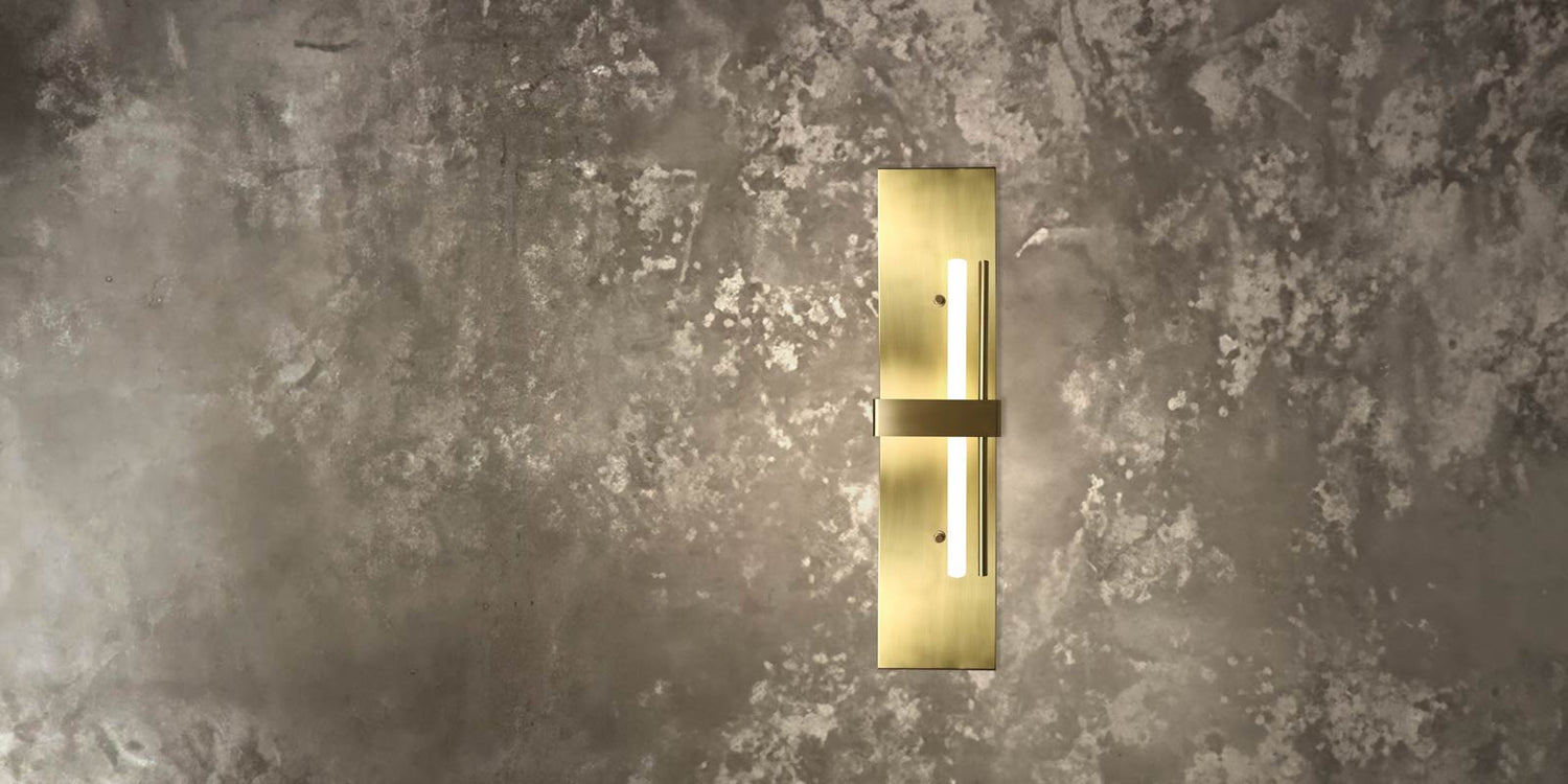 Italian Design Lighting in brass by Ghidini 1849 - brass wall lamp made in Italy with concrete wall background