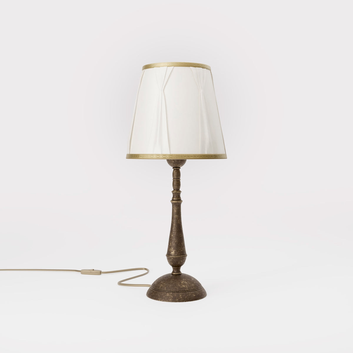 Classic brass table lamp with ivory fabric shade and decorative trims, round base and turned stem by Ghidini 1849 - Dimension/Finish: Medium / OAS Antique Brass