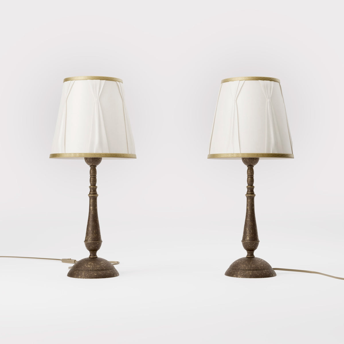 Classic brass table lamp with ivory fabric shade and decorative trims, round base and turned stem by Ghidini 1849 - Dimension/Finish: Medium / OAS Antique Brass