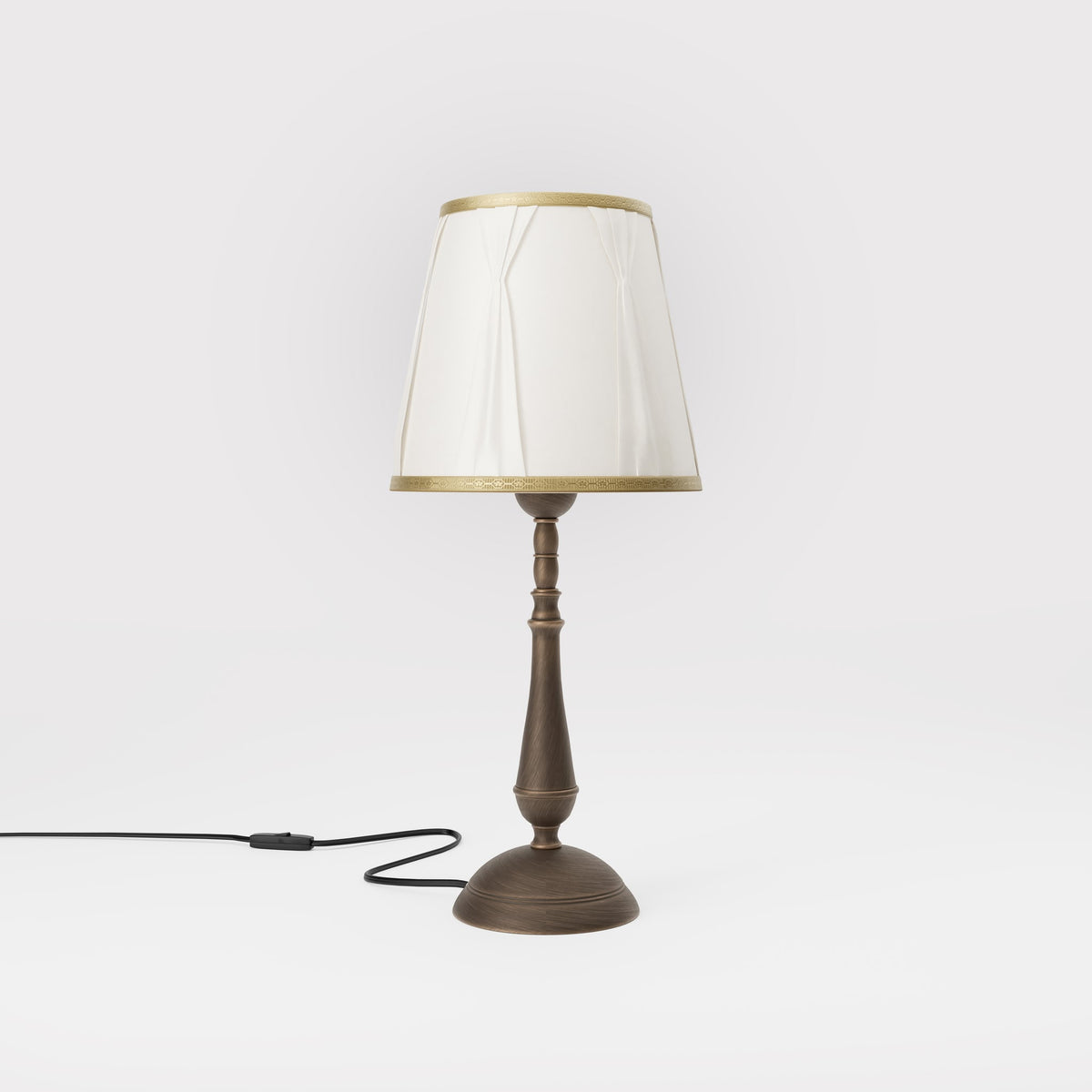 Classic brass table lamp with ivory fabric shade and decorative trims, round base and turned stem by Ghidini 1849 - Dimension/Finish: Medium / OBM Bronze Satin Matt Brass