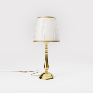 Classic brass table lamp with ivory fabric shade and decorative trims, round base and turned stem by Ghidini 1849 - Dimension/Finish: Medium / OLV Polished Brass