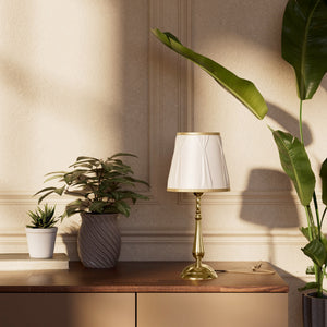 Classic brass table lamp with ivory fabric shade and decorative trims, round base and turned stem by Ghidini 1849 - Dimension/Finish: Medium / OLV Polished Brass