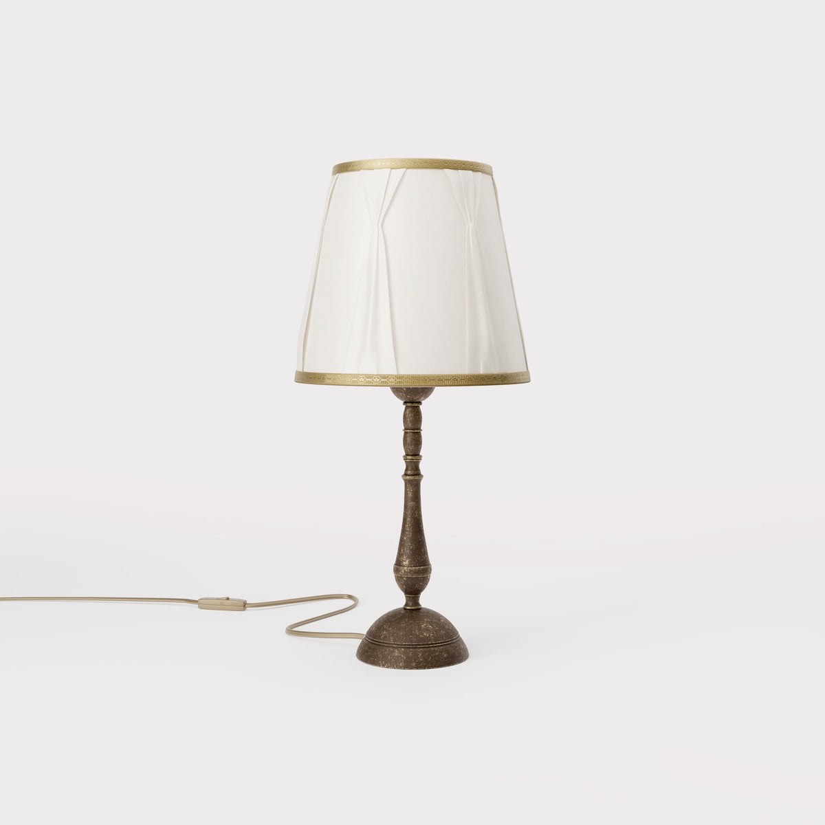 Classic brass table lamp with ivory fabric shade and decorative trims, round base and turned stem by Ghidini 1849 - Dimension/Finish: Small / OAS Antique Brass