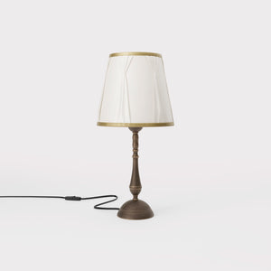 Classic brass table lamp with ivory fabric shade and decorative trims, round base and turned stem by Ghidini 1849 - Dimension/Finish: Small / OBM Bronze Satin Matt Brass