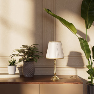 Classic brass table lamp with ivory fabric shade and decorative trims, round base and turned stem by Ghidini 1849 - Dimension/Finish: Small / OLV Polished Brass